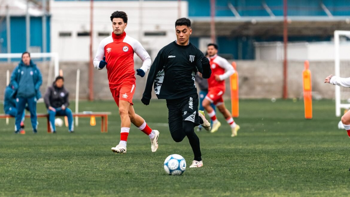 Young soccer players practicing during a training session on an outdoor field.